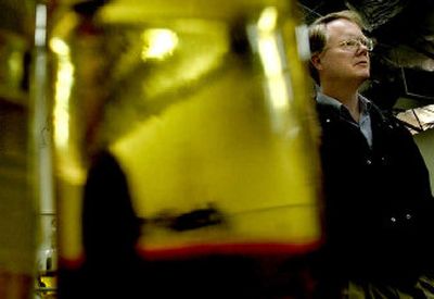 
Dr. Jon H. Van Gerpen stands near a flask of biodiesel produced by the University of Idaho. Van Gerpen, a mechanical engineer, is the new head of the biological and agricultural engineering department. He was recently recruited from Iowa to direct the biodiesel program. 
 (Photos by KATHY PLONKA / The Spokesman-Review)