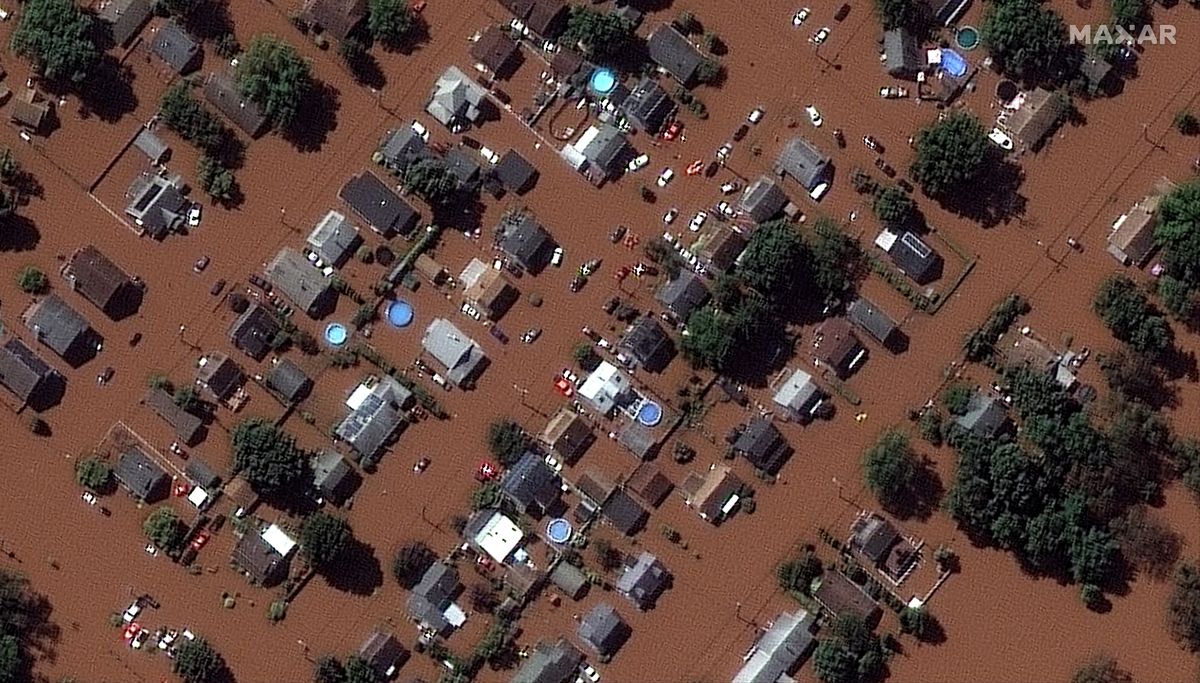 In a satellite image provided by Maxar Technologies, homes along Boessel Ave., in Manville, N.J. are surrounded by floodwaters Thursday, Sept. 2, 2021, after remnants of Hurricane Ida swept through the area  (HONS)