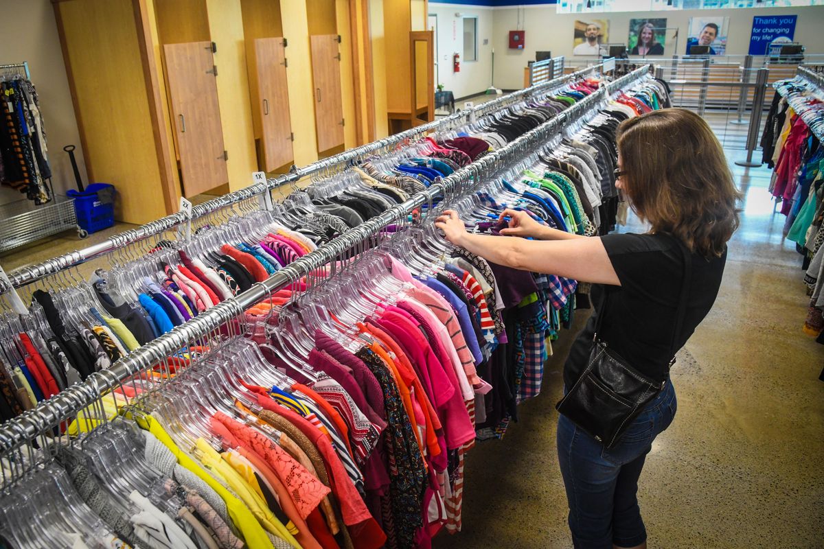 A goodwill customer shops for clothes, Thursday, July 11, 2019, at the renovated store on 27th Avenue in Spokane. (Dan Pelle / The Spokesman-Review)