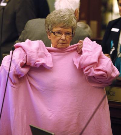 Idaho Senator Shirley McKague tries on a snuggie during a break in the Senate Chambers about an hour before the close of the 2010 session on Monday, March 29, 2010 in Boise, Id. (Matt Cilley / Fr117486 Ap)