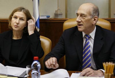 
Israeli Prime Minister Ehud Olmert and Foreign Minister Tzipi Livni, left, attend a  Cabinet meeting  in Jerusalem on Wednesday.
 (Associated Press / The Spokesman-Review)