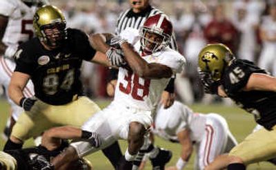 
Alabama running back Glen Coffee is surrounded by Colorado defenders. Associated Press
 (Associated Press / The Spokesman-Review)