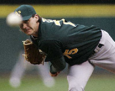 
A's starting pitcher Barry Zito fires pitch in Wednesday's game, at Safeco Field.
 (Associated Press / The Spokesman-Review)