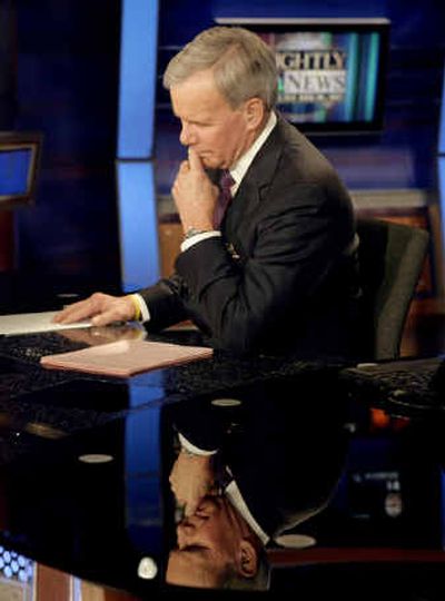 
NBC Nightly News anchor Tom Brokaw listens to a report Wednesday during his last broadcast.
 (Associated Press / The Spokesman-Review)