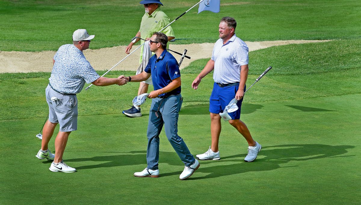 Daniel Campbell from Bellingham Golf and Country Club ( center in blue ) shakes hands with Conner Robbins ( left ) as Andrew Von Lossow joins from the right. Campbell won the 2025 Rosauers Open golf Tournament at Indian Canyon with a birdie on the 18th hole.   (Christopher Anderson/For The Spokesman-Review)