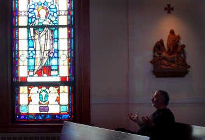 
Maurice Smith, a pastor and director of Feed Spokane, meditates at University Chapel at Gonzaga University. 
 (Photos by Jesse Tinsley / The Spokesman-Review)