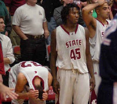 WSU's Daven Harmeling, left, and Jeff Varem react to loss.
(Kevin Nibur/ / The Spokesman-Review)