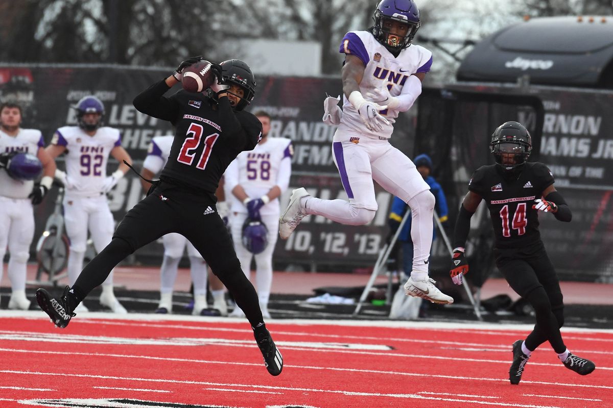 Eastern Washington defensive back Keshaun King (21) intercepts the ball intended for Northern Iowa wide receiver Deion McShane (1) during second half of a FCS college football playoff game, Saturday, Nov. 27, 2021, on Roos Field in Cheney, Wash.  (COLIN MULVANY/THE SPOKESMAN-REVIEW)