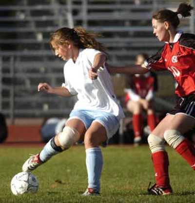 
Central Valley's Abbie Corigliano  tries to change direction while under pressure from Jordan Ray  of North Central during a game at CV  Wednesday.
 (Holly Pickett / The Spokesman-Review)