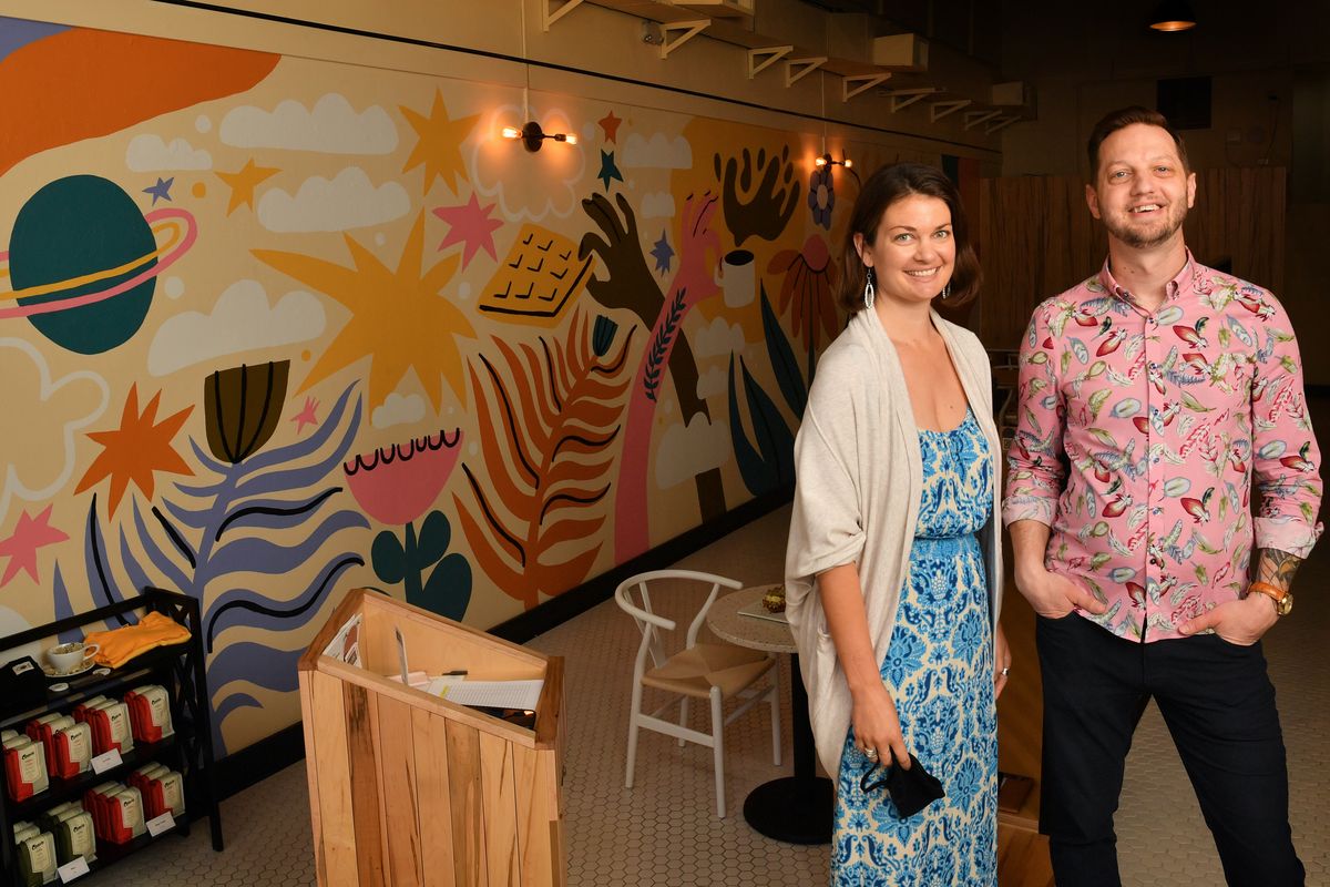 People’s Waffle co-owners Alyssa Agee and Aaron Hein stand in the restaurant, which opened in April at 15 S. Howard St. in downtown Spokane. Agee’s husband, Bryan, also is a co-owner.  (Tyler Tjomsland/The Spokesman-Review)