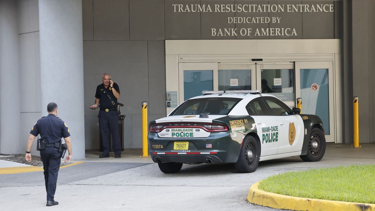 Police officers arrive at Ryder Trauma Center at Jackson Memorial Hospital after two Miami police officers were shot while responding to a call on a shooting on Thursday morning, Oct. 9, 2025, in Allapattah, Florida. (Al Diaz/Miami Herald/TNS)
