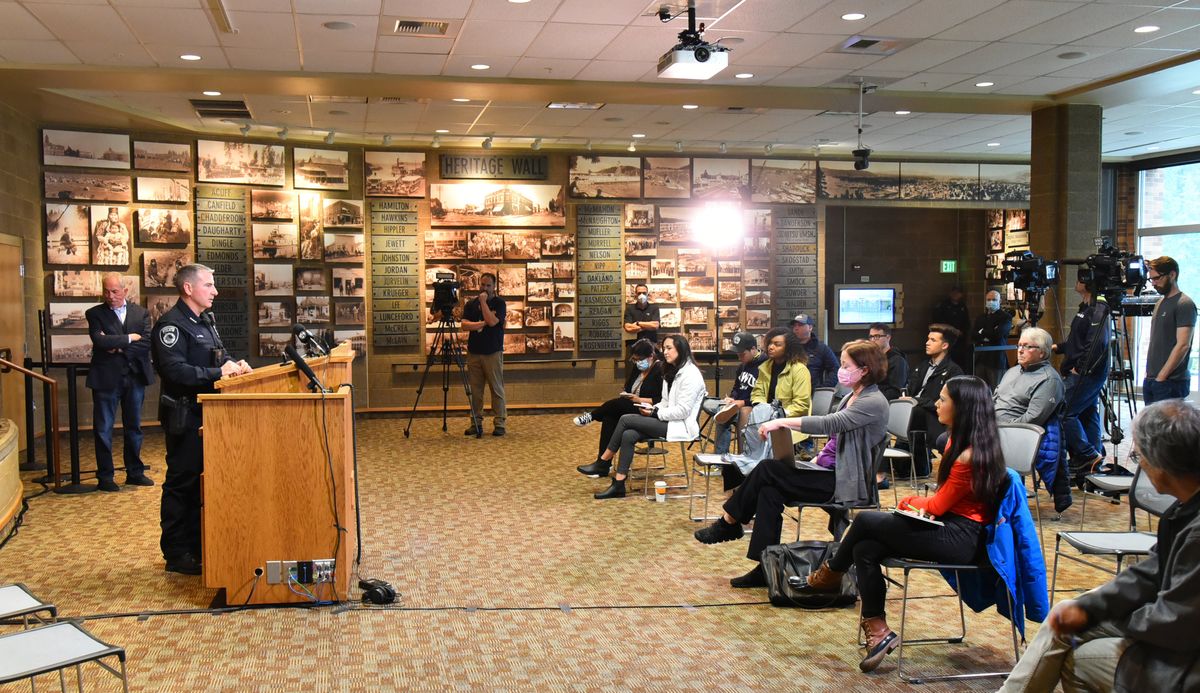 Coeur d’Alene police Chief Lee Whiter, second from left, takes questions from the media during a June 13 news conference in the Coeur d’Alene Library about the arrest of 31 members of the Patriot Front nationalist group.  (Jesse Tinsley/The Spokesman-Review)