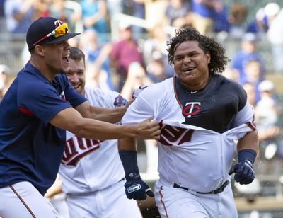 In this Sept. 9, 2018, file photo, Minnesota Twins’ Willians Astudillo, right, is mobbed by teammate Jose Berrios after hitting a 2-run home run during the ninth inning of a baseball game against the Kansas City Royals, in Minneapolis. (Paul Battaglia / Associated Press)