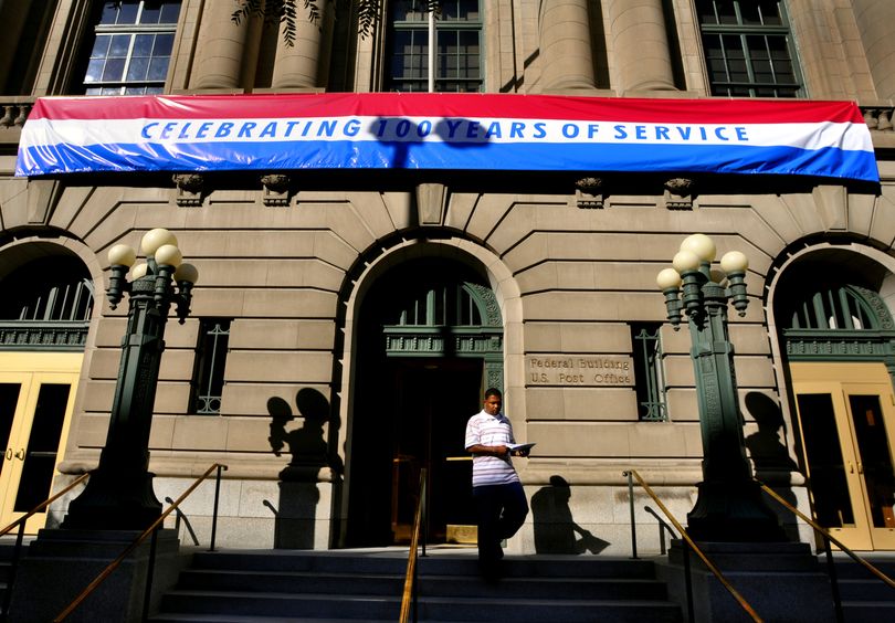 The U.S. Post Office building at Riverside and Lincoln is pictured at its centennial celebration. It opened on Oct. 4, 1909. The office is in the process of relocating to another downtown location. (Colin Mulvany / The Spokesman-Review)