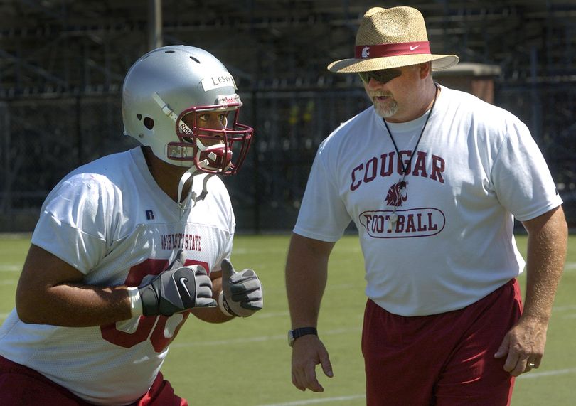 One of George Yarno’s coaching jobs was at his alma mater, Washington State. In this 2007 photo, he is shown coaching offensive linemen. (Dan Pelle / The Spokesman-Review)