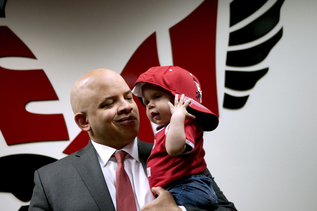 New EWU men’s basketball coach Shantay Legans, with his daughter Zola Lee, 9 months. (Kathy Plonka/The Spokesman-Review)