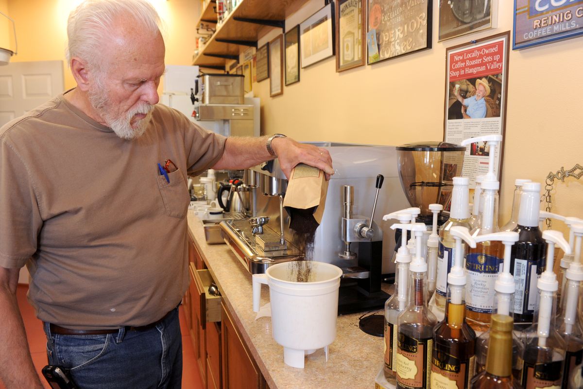Veteran coffee roaster Tom Sawyer, shown in his little roasting shop in Hangman Valley Wednesday, Aug. 3, 2011, starts his recipe for iced coffee with a pound of smooth Sumatran coffee steeped in cold water overnight, then combined with a variety of combinations of milk, water and flavorings to produce a smooth summer drink with none of the bitterness of hot-brewed coffees. He uses a "toddy maker", a filtered jug, to make the concentrated coffee, which is later combined with other ingredients. (Jesse Tinsley / The Spokesman-Review)