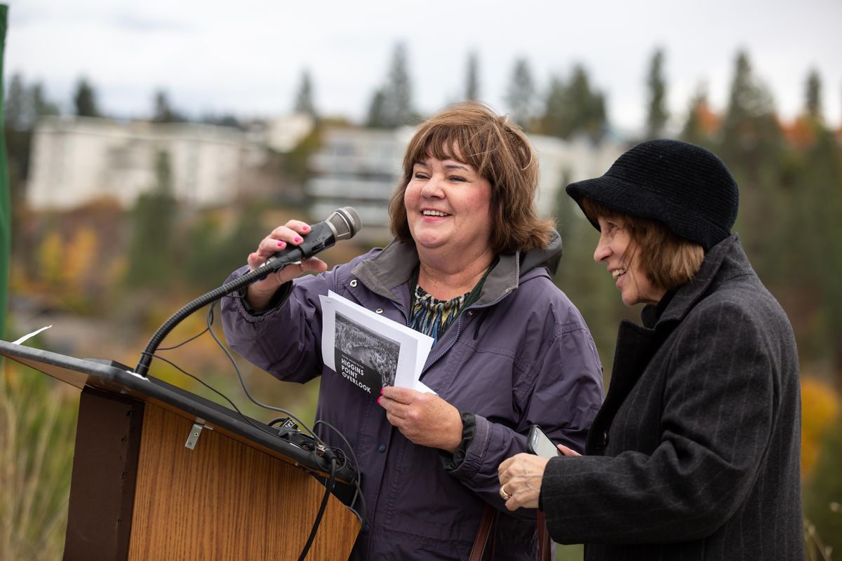 City Councilwomen Karen Stratton (left) and Lori Kinnear speak during the city of Spokane Parks & Recreation-hosted unveiling for the Higgins Point Overlook on Oct. 17, 2019. Don Higgins, who served the West Central Community Center over three decades, listened to stories of his own impact from friends, family and community leaders. (Libby Kamrowski / The Spokesman-Review)
