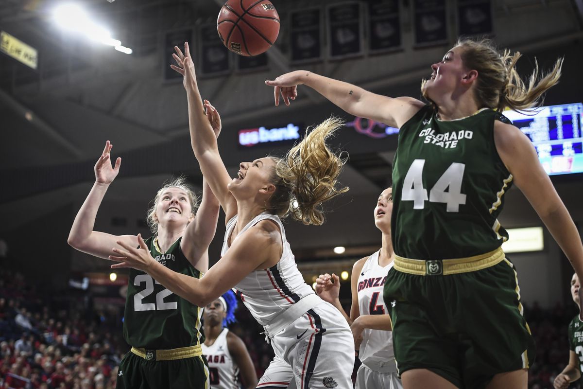 Gonzaga guard Laura Stockton is fouled by Colorado State forward Tatum Neubert (44) as Lauren Brocke (22) also defends, Nov. 28, 2018, in the McCarthey Athletic Center. (Dan Pelle / The Spokesman-Review)