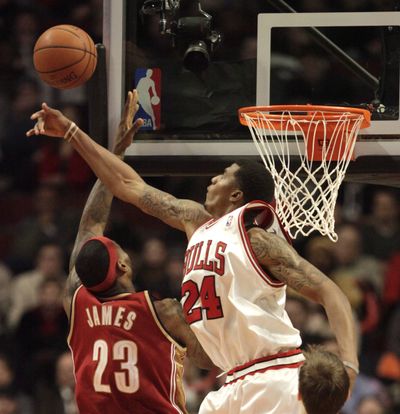 Chicago’s Tyrus Thomas blocks the shot of Cleveland’s LeBron James.  (Associated Press / The Spokesman-Review)