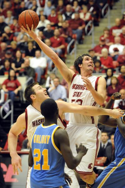 Caleb Forrest, who scored 19 points, throws up an off-balance shot in the key late in the second half.  (Jesse Tinsley / The Spokesman-Review)