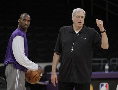 The Lakers’ Kobe Bryant, left, says he and coach Phil Jackson have grown closer over the years. (Associated Press / The Spokesman-Review)