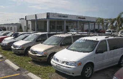 
The Palm Chevrolet and Oldsmobile dealership in Punta Gorda, Fla., continues to operate, despite damage from the effects of Hurricane Charley.
 (Associated Press / The Spokesman-Review)