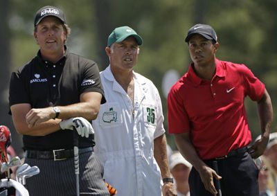 Phil Mickelson, left, and Tiger Woods made things interesting. (Associated Press / The Spokesman-Review)