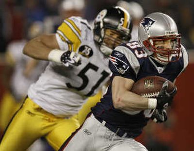 
Wide receiver Wes Welker, pursued by James Farrior, caught one of four New England TD passes. Associated Press
 (Associated Press / The Spokesman-Review)
