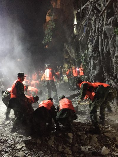 In this photo released by China's Xinhua News Agency, rescuers work at a tourist site in Zhangzha in Jiuzhaigou county in southwestern China's Sichuan province, Wednesday, Aug. 9, 2017. (Zheng Lei / Associated Press)