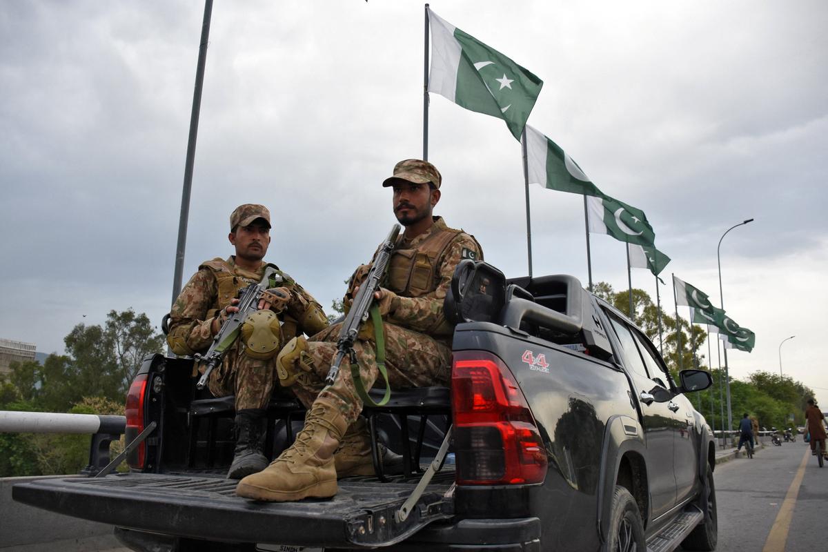 Army soldiers patrol a road on Friday in Islamabad as Pakistan prepares to host U.S. and Iran for the second round of peace talks.  (Reuters)