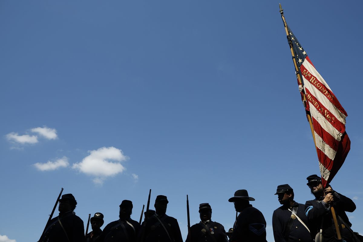 Members of the U.S. Colored Troops and Buffalo Soldiers, living historians and re-enactors from Maryland, Georgia, Massachusetts and other states, prepare to march in the Juneteenth People’s Parade on June 19 in Washington, D.C.  (Getty Images)