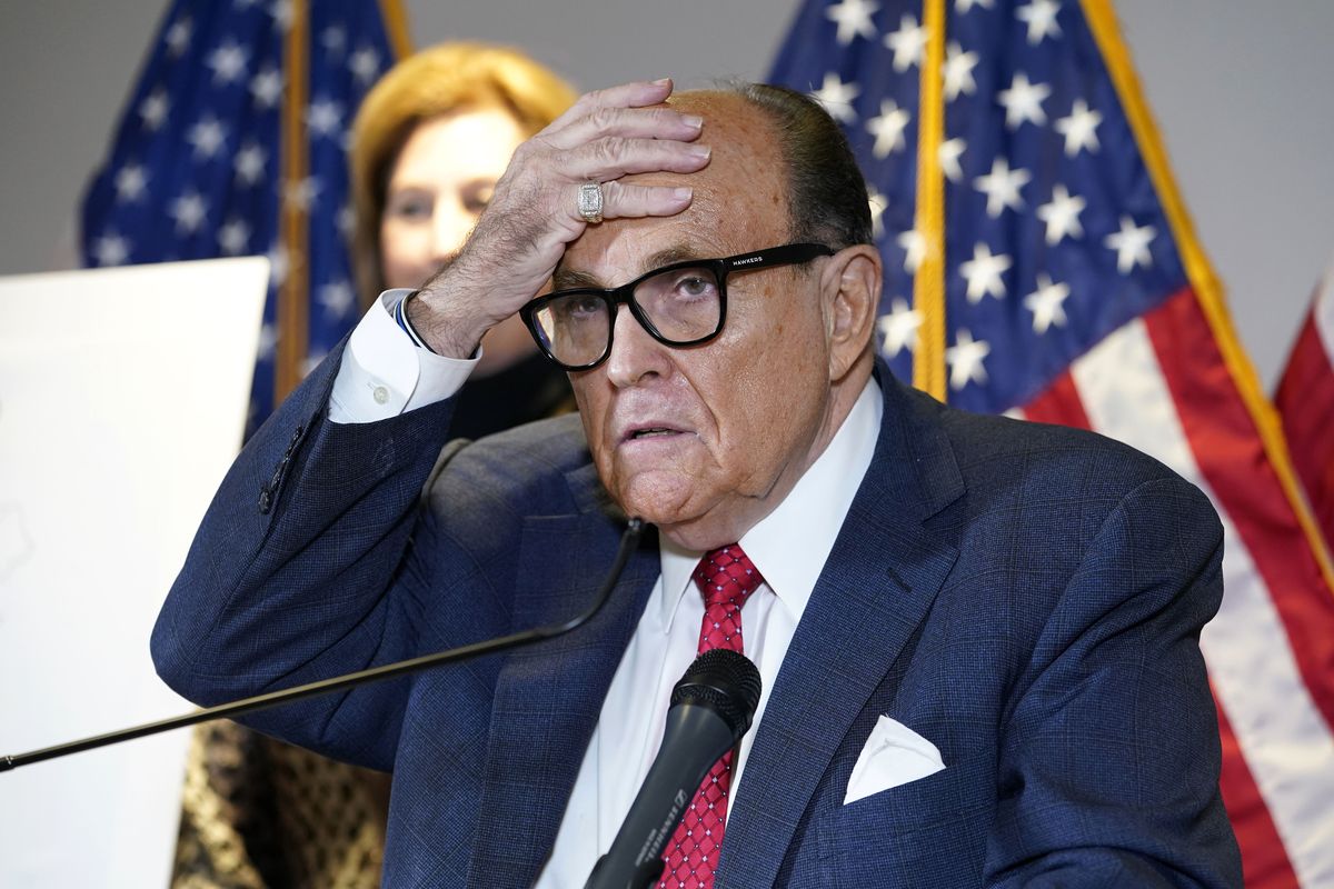 FILE - In this Nov. 19, 2020, file photo, former New York Mayor Rudy Giuliani, who was a lawyer for President Donald Trump, speaks during a news conference at the Republican National Committee headquarters in Washington. A law enforcement official tells the Associated Press that federal investigators have executed a search warrant at Rudy Giuliani