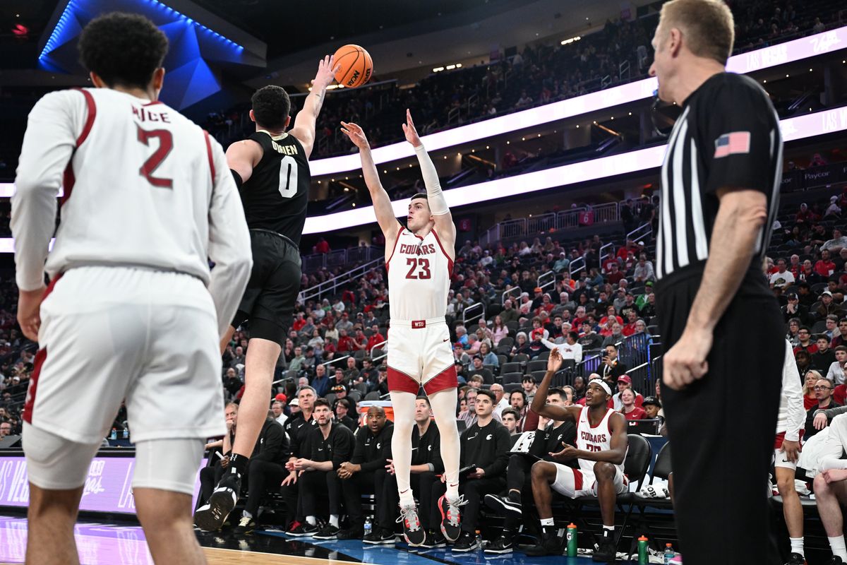 Washington State Cougars forward Andrej Jakimovski (23) takes an outside shot but is ruled out of bounds against Colorado Buffaloes guard Luke O
