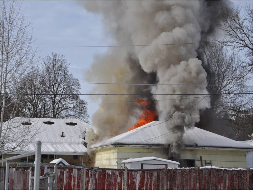 A garage fire burns at 3102 N. Lily Road on Dec. 7, 2010. Photo is courtesy of the Spokane Valley Fire Department. (Photo courtesy Spokane Valley Fire Department)