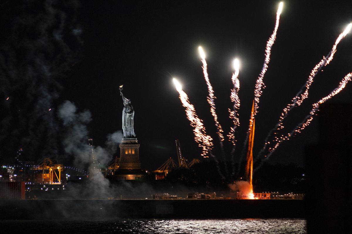 Fireworks launched from a barge explode over New York Harbor and the Statue of Liberty as New York and other cities around New York state recognize a rate of 70% for single dose vaccinations against the COVID-19 virus, Tuesday, June 15, 2021 in New York. Celebration of the milestone was announced by Gov. Andrew Cuomo earlier in the day.  (Craig Ruttle)