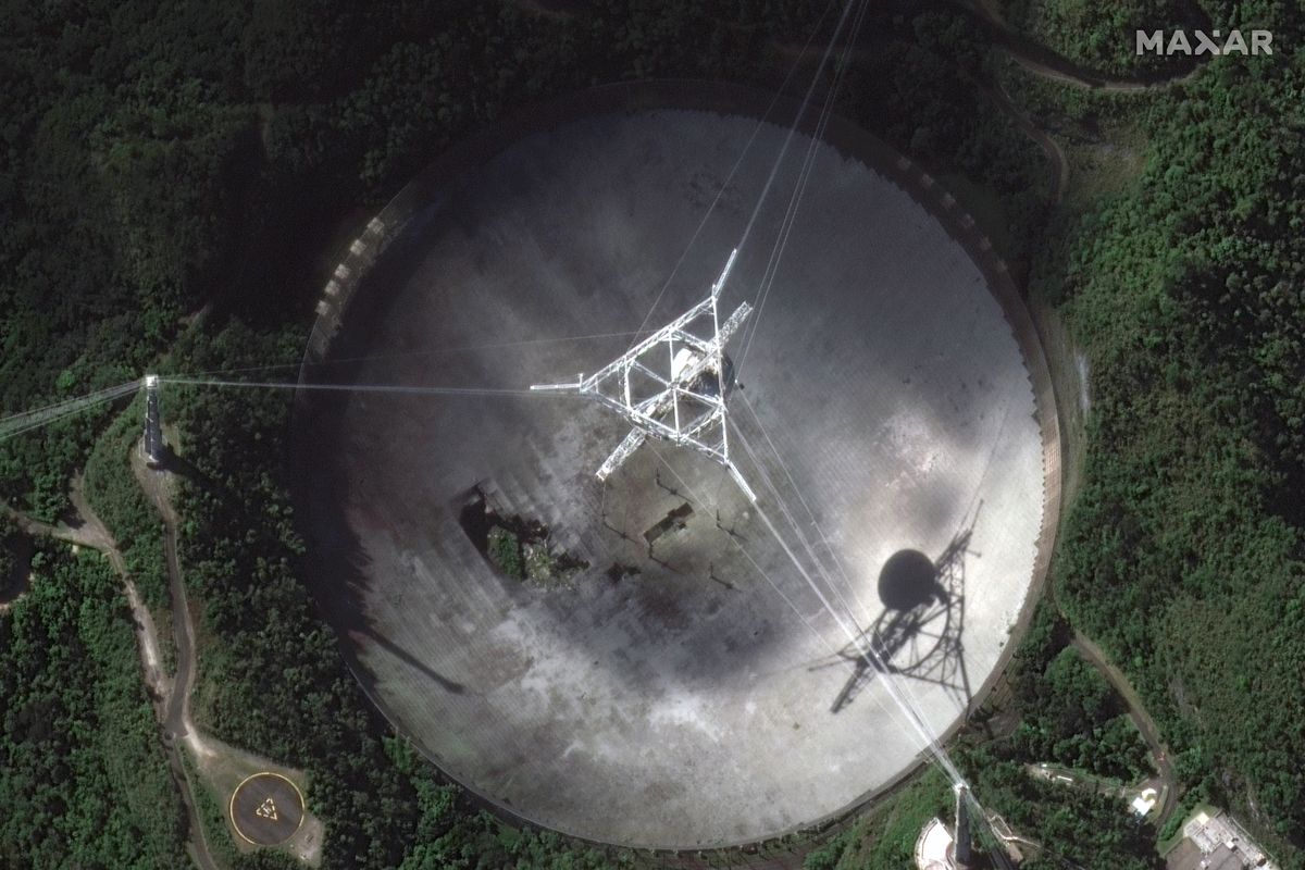 This satellite image provided by 2020 Maxar Technologies shows the damaged radio telescope at the Arecibo Observatory in Puerto Rico, Thursday, Nov. 17, 2020. The National Science Foundation announced Thursday, Nov. 17 that it will close the huge telescope in a blow to scientists worldwide who depend on it to search for planets, asteroids and extraterrestrial life, saying it’s too dangerous to keep operating the single-dish radio telescope because the entire structure could collapse.  (HONS)