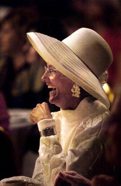 
Marianne Jolley, co-hostess of her table, laughs during the Season of Style high tea. The Spokane Valley Community Center hosted the tea that included a marketplace with artworks and crafts and a holiday fashion show Saturday at the Mirabeau Park Hotel in Spokane Valley. 
 (Amanda Smith / The Spokesman-Review)