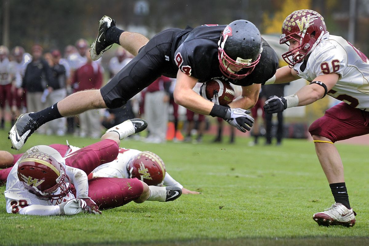 Whitworth tight end Wade Meyer launches himself into the end zone Saturday for a second-quarter touchdown.  (Christopher Anderson)
