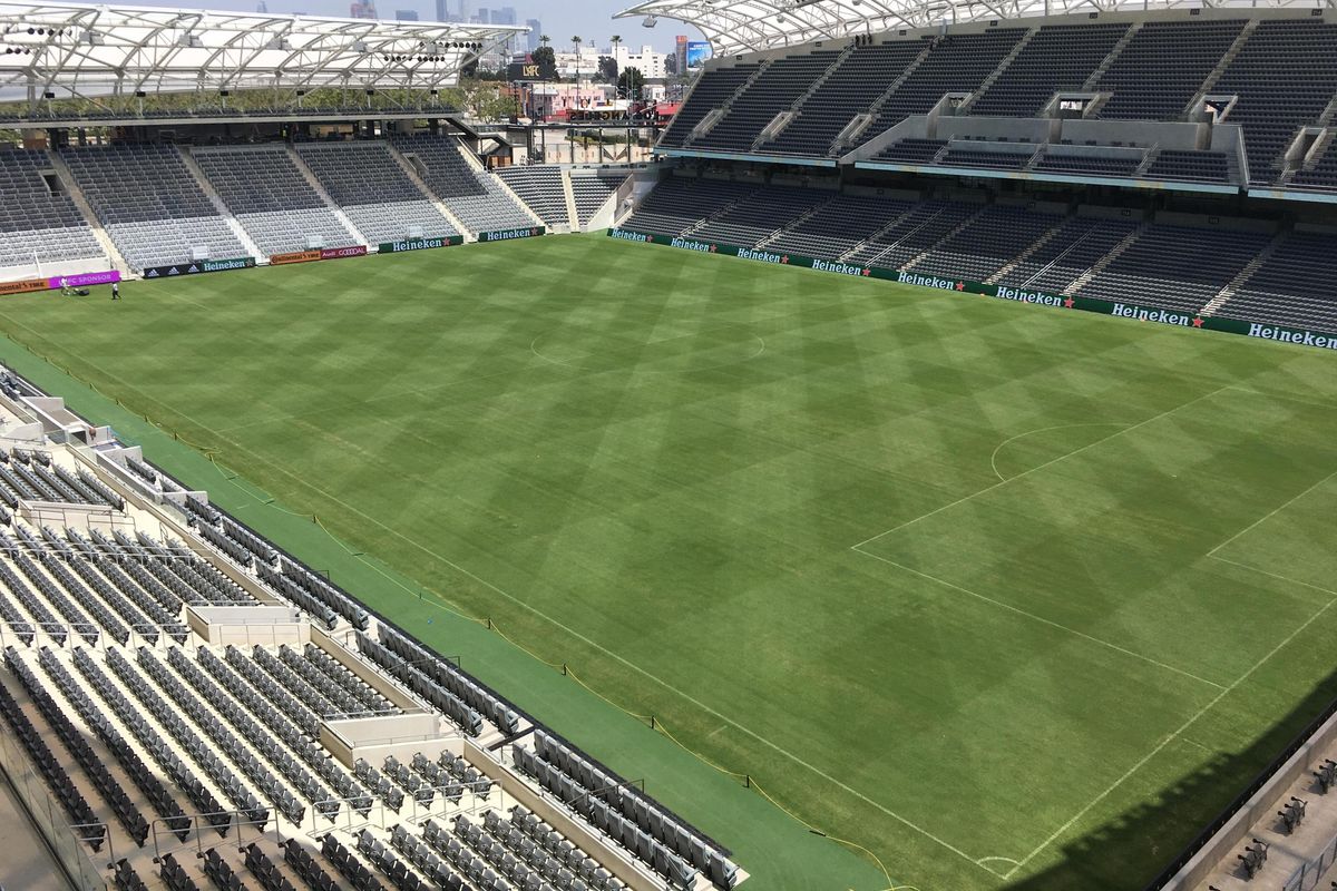 In this Thursday, April 26, 2018, photo workers prepare the playing field at Banc of California Stadium for its official opening Sunday, April 29, and the upcoming home debut of Los Angeles Football Club. The MLS expansion team built its $350 million new home in about 18 months, using cutting-edge design to create a throwback feel for the new club’s fans. (Greg Beacham / Associated Press)