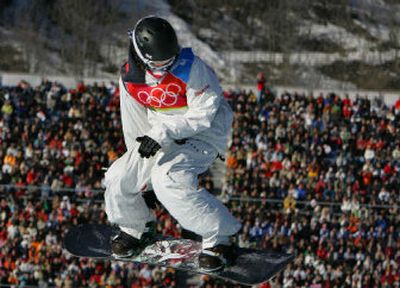 
American Shaun White sails above the crowd during his first run to take the gold medal for the men's halfpipe. American Daniel Kass took the silver. 
 (Associated Press / The Spokesman-Review)