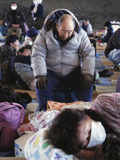 Evacuees rest at a shelter in Otsuchi, Iwate, northern Japan, on Monday.