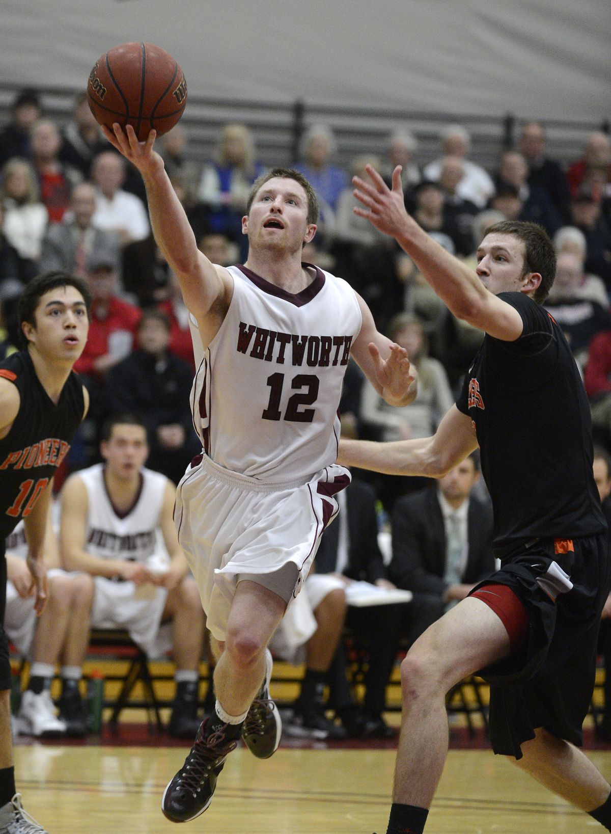 Whitworth’s Wade Gebbers lays in the ball to score two of his 22 points in the Pirates’ victory. (Colin Mulvany)