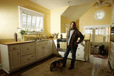
J.D. Doliner and her husband hired a contractor to redesign their home, making it more environmentally friendly. The couple uses solar panels to generate a portion of their electricity and hot water. 
 (Associated Press / The Spokesman-Review)