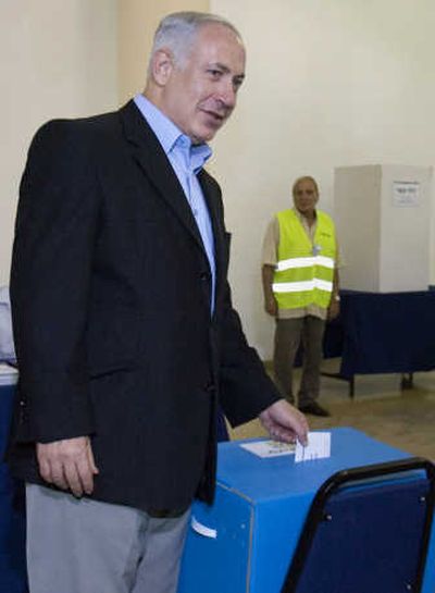
Former Prime Minister Benjamin Netanyahu votes at the party's primary elections, in Jerusalem on Tuesday.Associated Press
 (Associated Press / The Spokesman-Review)