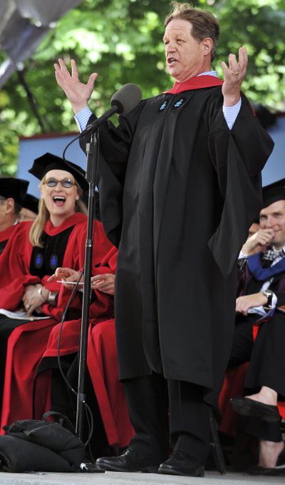 In this May 27, 2010, file photo, actress Meryl Streep, left, reacts as comedian Jimmy Tingle, graduating with a masters degree from the Kennedy School of Government, delivers the commencement address during then Harvard University commencement exercises in Cambridge, Mass. (Josh Reynolds / Associated Press)
