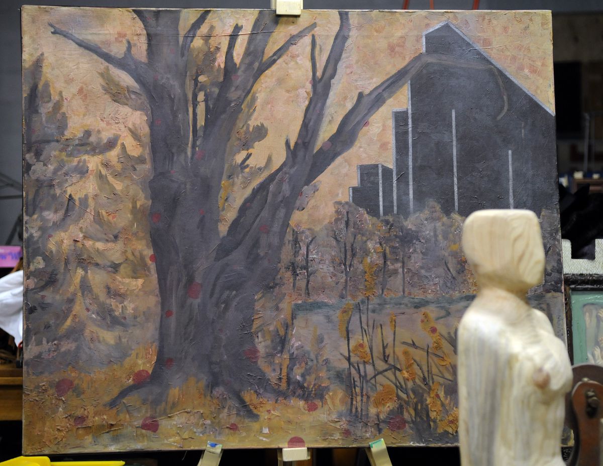Jon Swanstrom has a oil and acrylic work in progess titled “Corporate Invasion” in his Spokane studio.