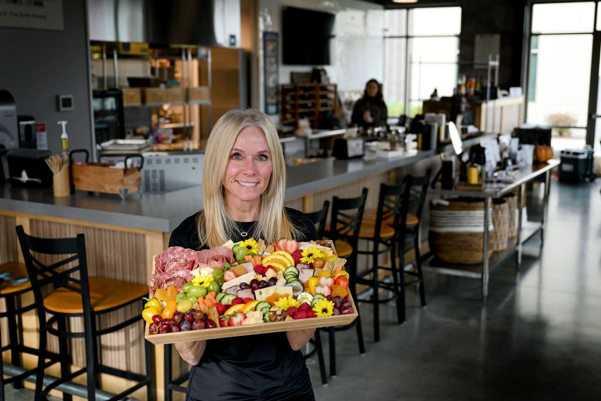 Graze Craze Charcuterie Boards & Boxes co-owner Cindy Rice displays one of her classics on Oct. 24 at the restaurant in Spokane Valley.  (Kathy Plonka/The Spokesman-Review)