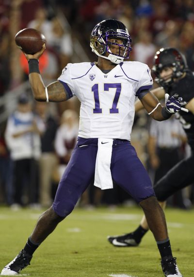 Withstanding pressure from Stanford’s front seven, UW QB Keith Price threw for 350 yards and two TDs. (Associated Press)