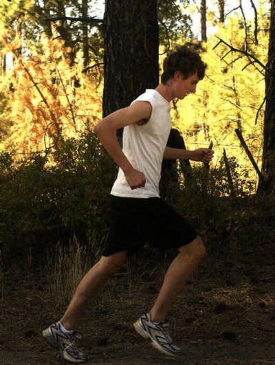 
East Valley's Nick Atwood seems oblivious to the surroundings during a training run. 
 (Liz Kishimoto / The Spokesman-Review)
